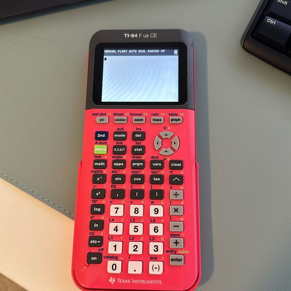 TI-84 Calcultor and charger